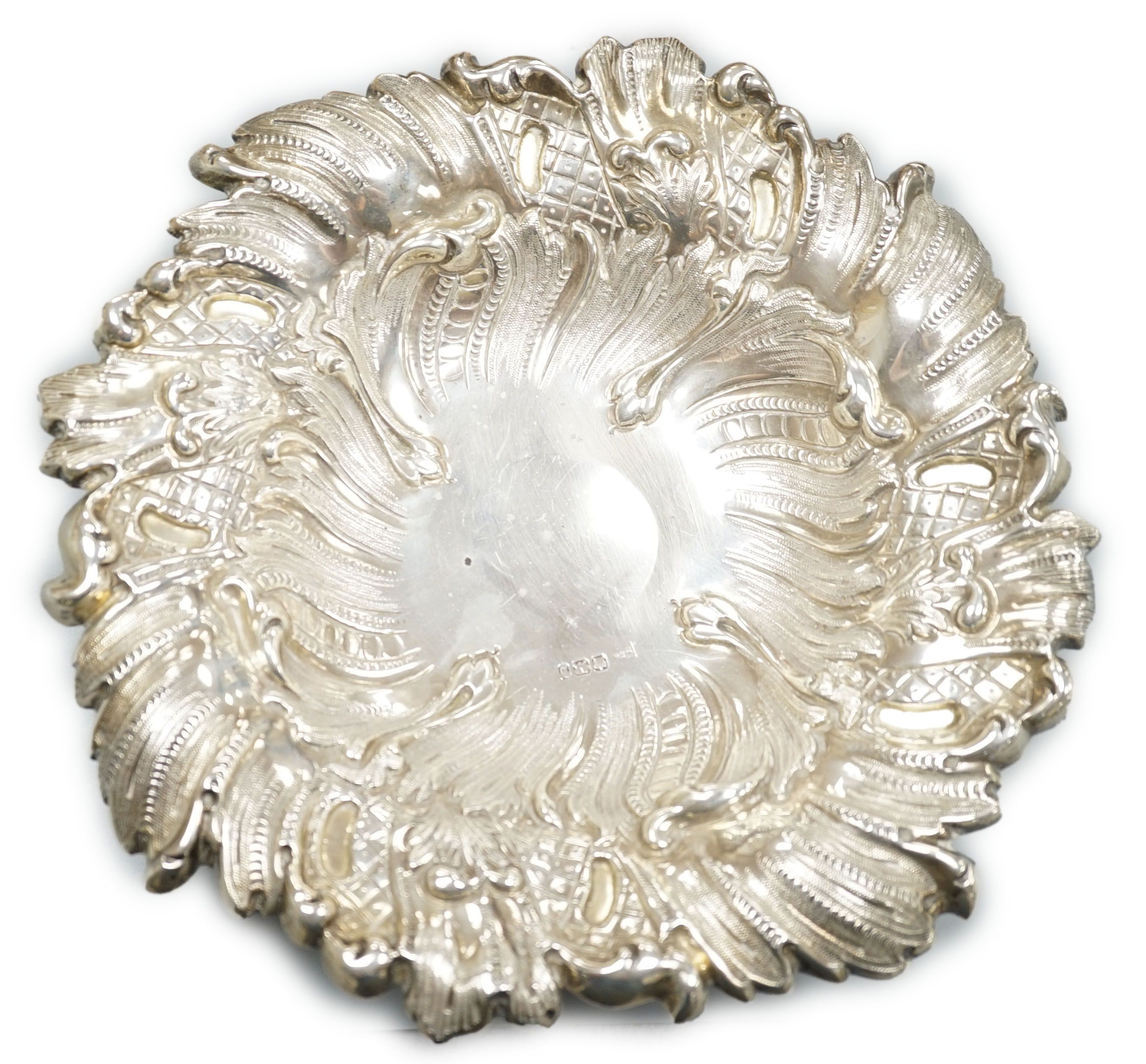 A late Victorian Neo-rococo fruit compote on pedestal stem, all over spiralling rocaille and wave chasing, makers Walker and Hall, Sheffield 1894, 26.75cm diameter, 22oz.